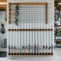 Neat garage wall mount rod rack organizing fishing rods vertically.